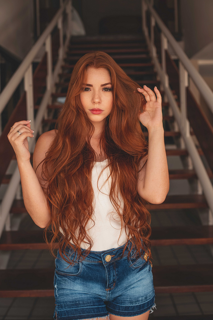 woman with long red wavy hair 