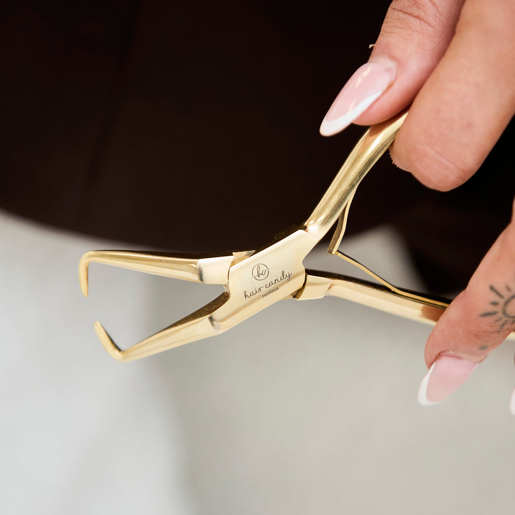 Close up of gold finish and design detail on Hair Candy De-Beader Pliers