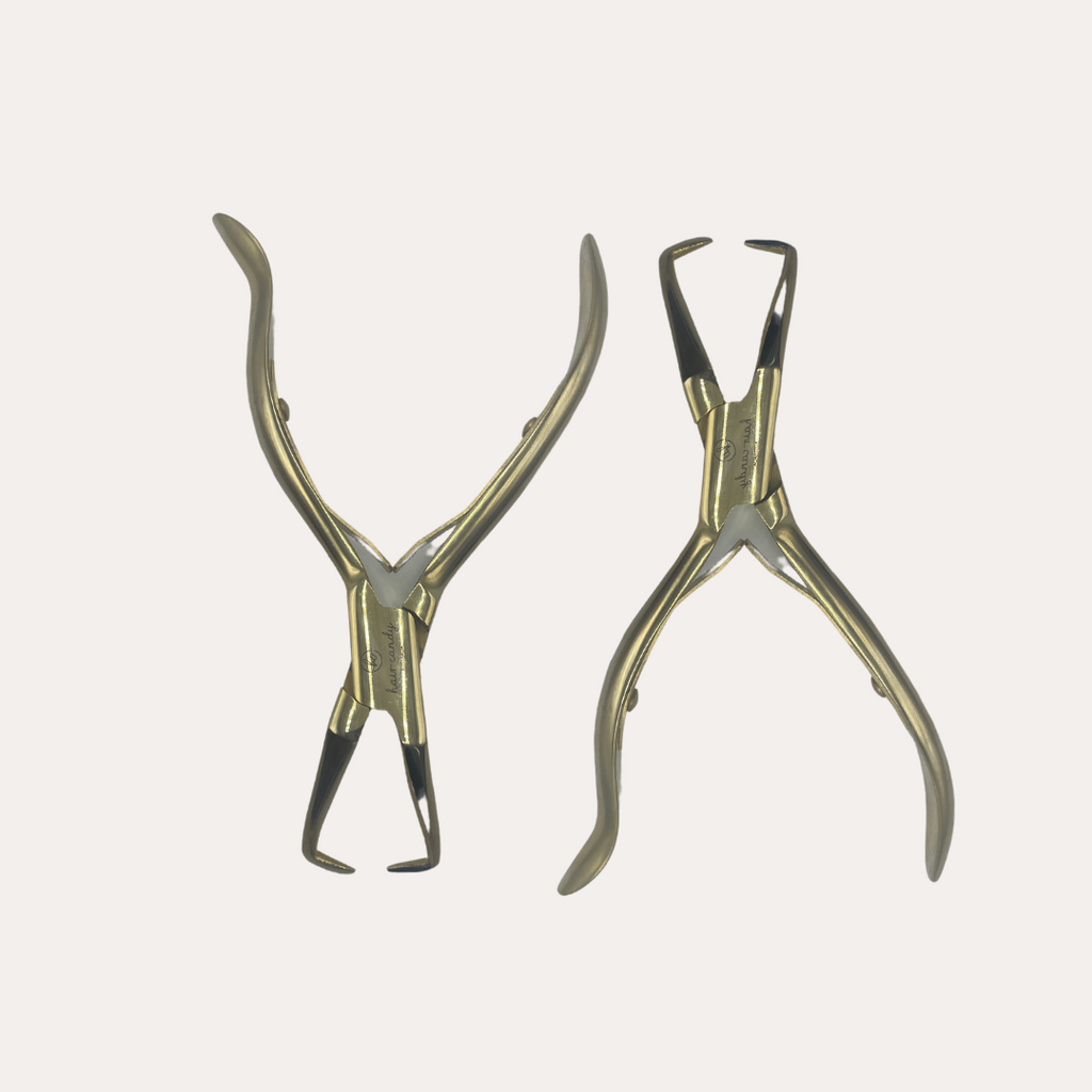 A pair of gold-colored 5-inch de-beader pliers designed for hair extension work.