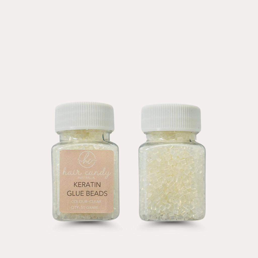 Two bottles of Keratin Bonds Bonding Glue, one with clear label and one with beads visible through the bottle