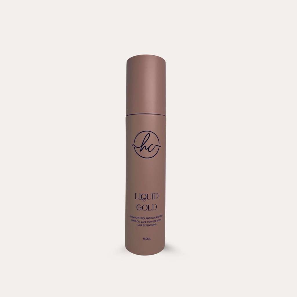 Brown bottle labeled 'Liquid Gold' on a light beige background