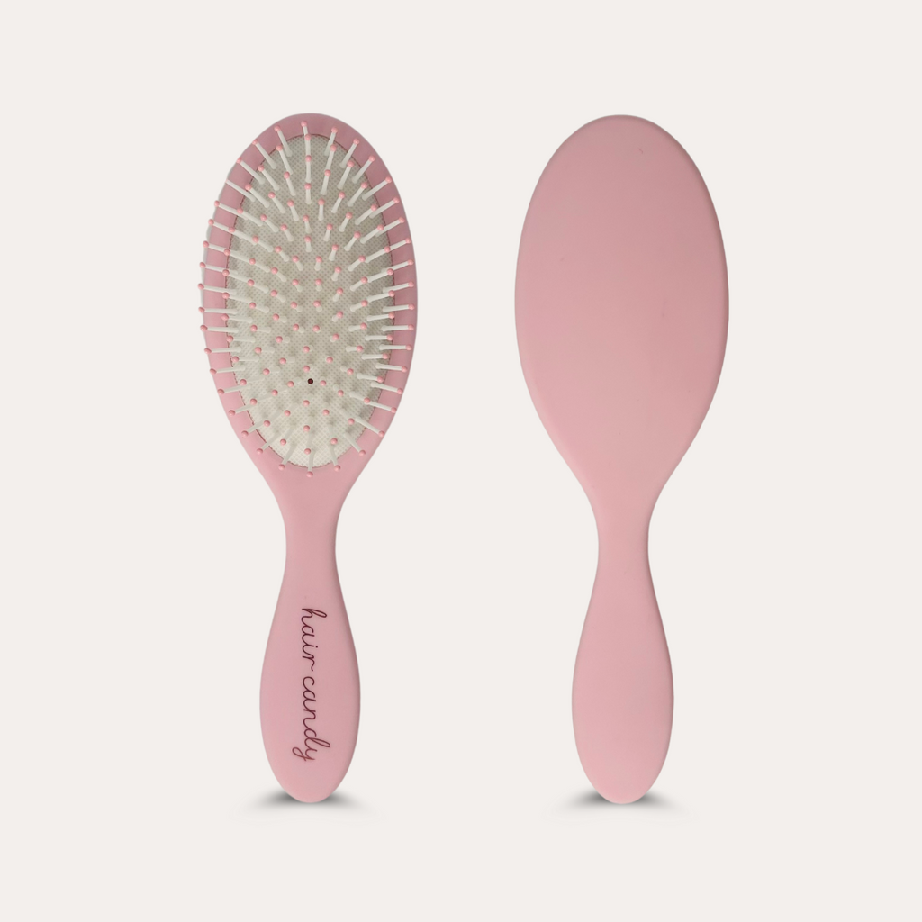 Hair Candy Signature Brush in pink with flexible bristles – gentle detangling for extensions