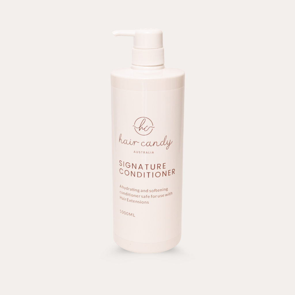 Hair candy conditioner bottle on a white background