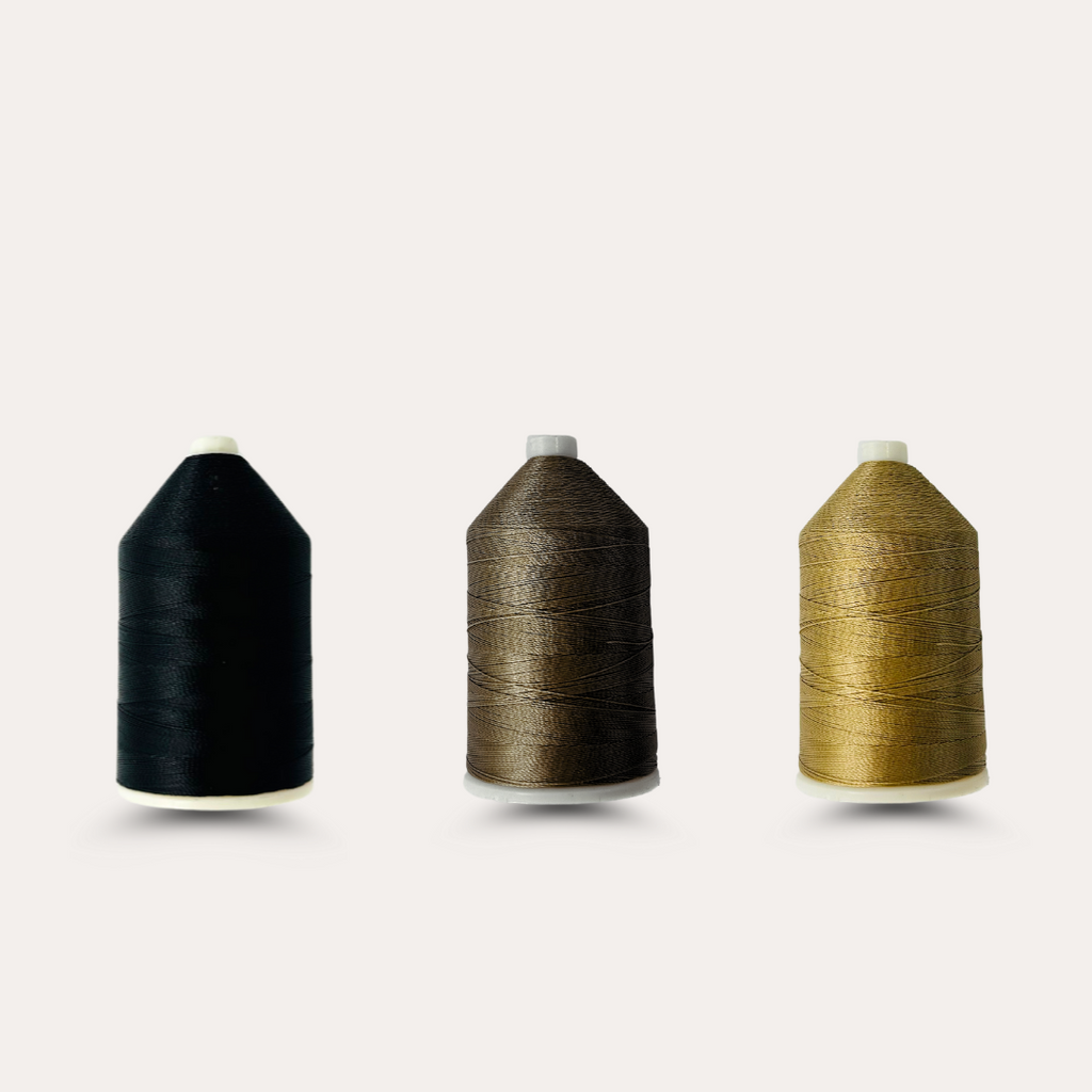 Three spools of Extension Thread in different colors: black, brown, and beige.