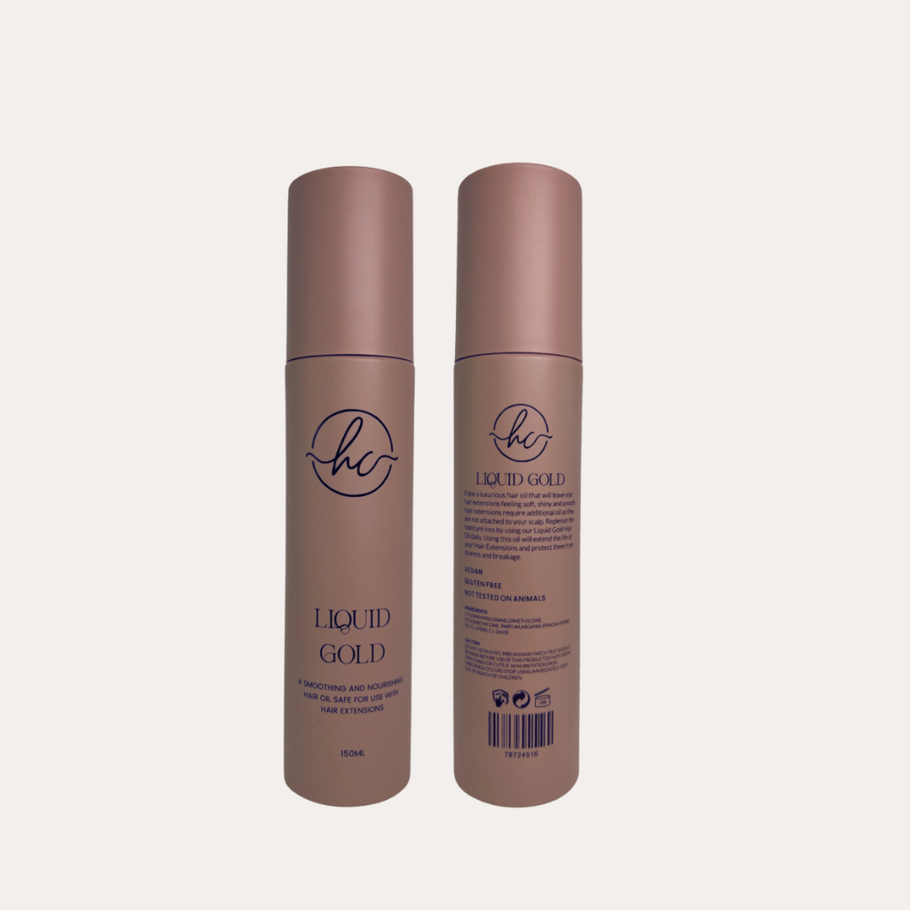 Two bottles of 'Liquid Gold' hair product on a light beige background