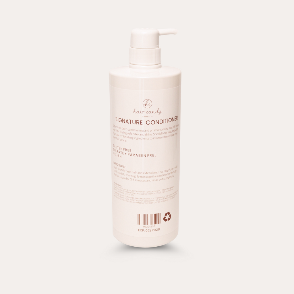 Bottle of hair conditioner with pump on a light background